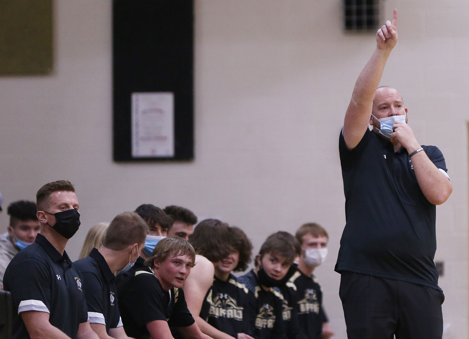 Tanner Hart calls an offensive play from the sidelines